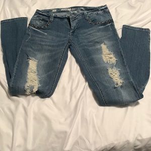 Distressed jeans with detail around pockets. Size 3 skinny fit
